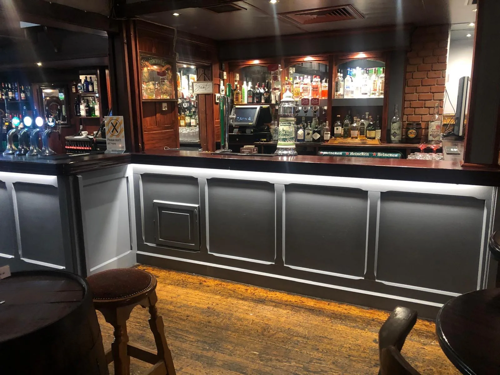 The traditional timber bar counter and drinks display
