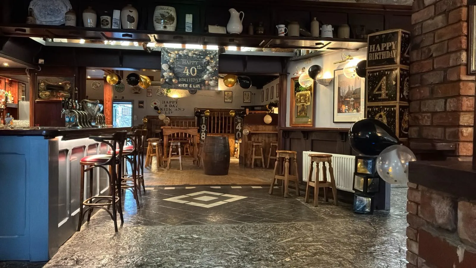 The bar decorated in black and gold for a birthday celebration