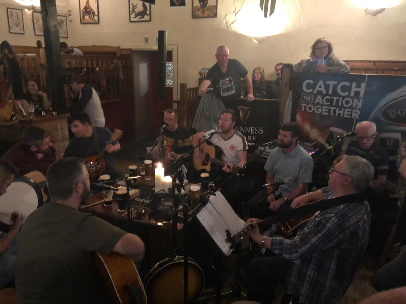 A lively traditional music session with a crowd at Lizzy Langton’s