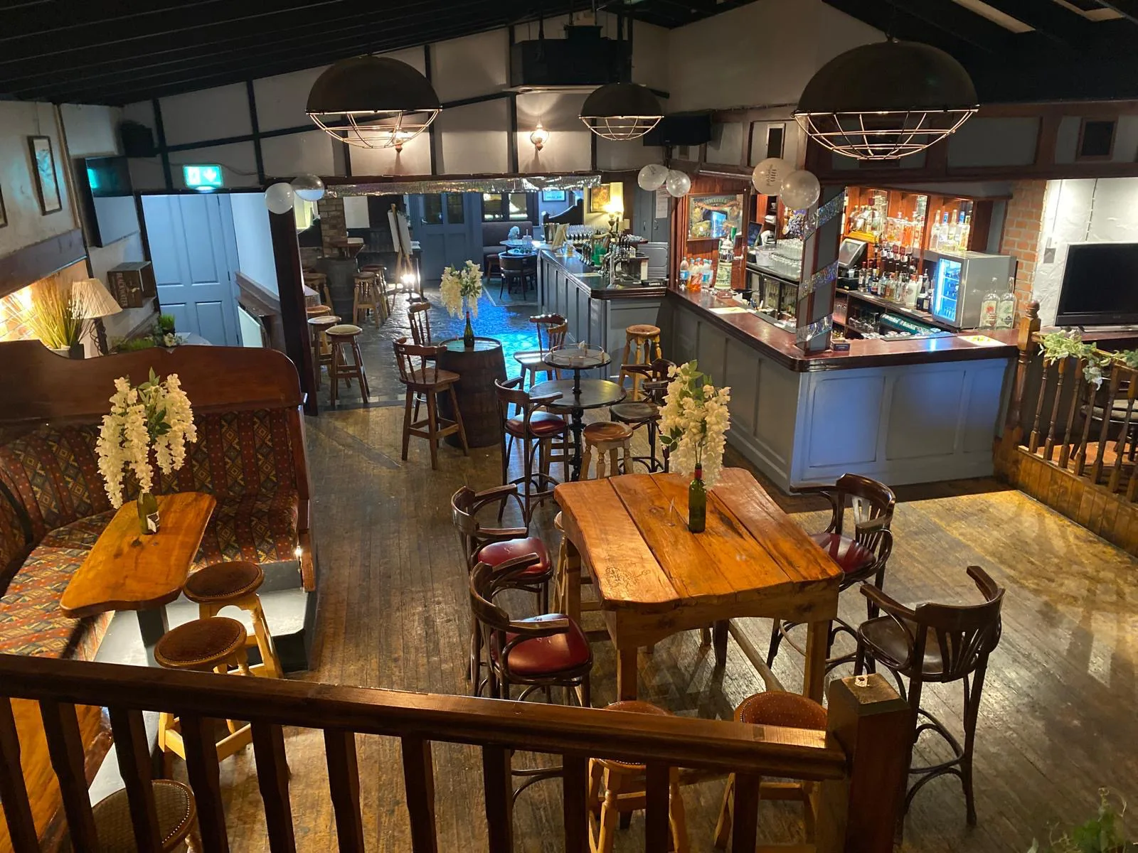 An elevated view across the timber tables and central bar at Lizzy Langton’s